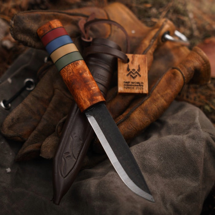 Viking Knife with wooden handle and leather sheath on a textured surface