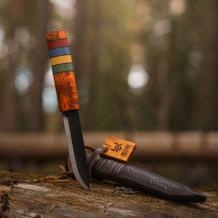 Viking Knife with wooden handle and leather sheath on a textured surface